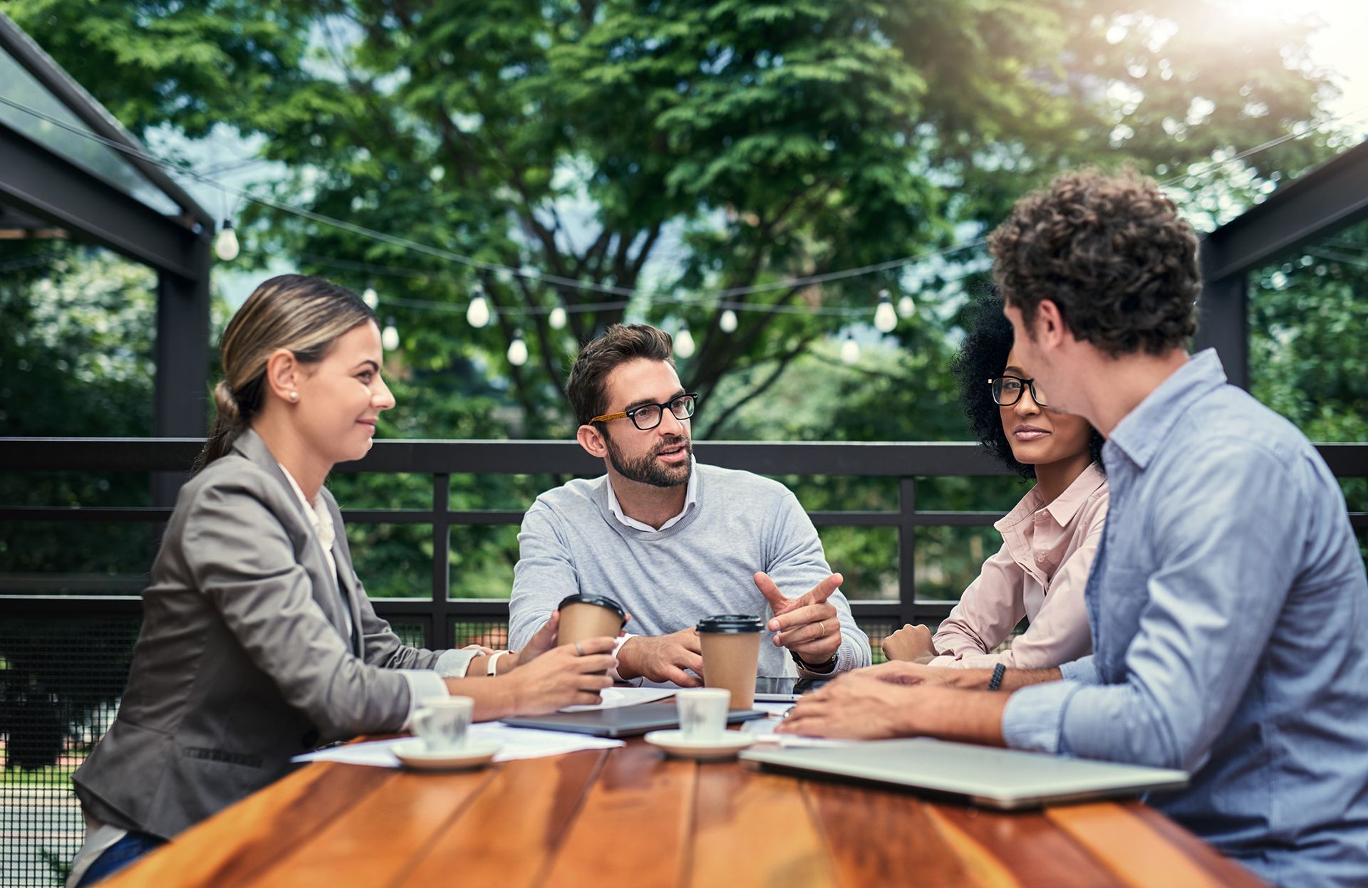 Four diverse colleagues having a discussion